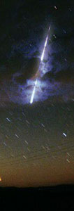 Meteor through clouds